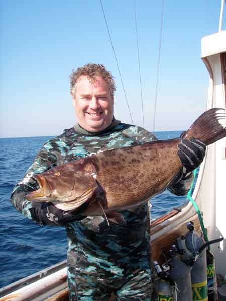 Diver Cliff Cason and a Grouper from the Manuela - Dive Hatteras photo